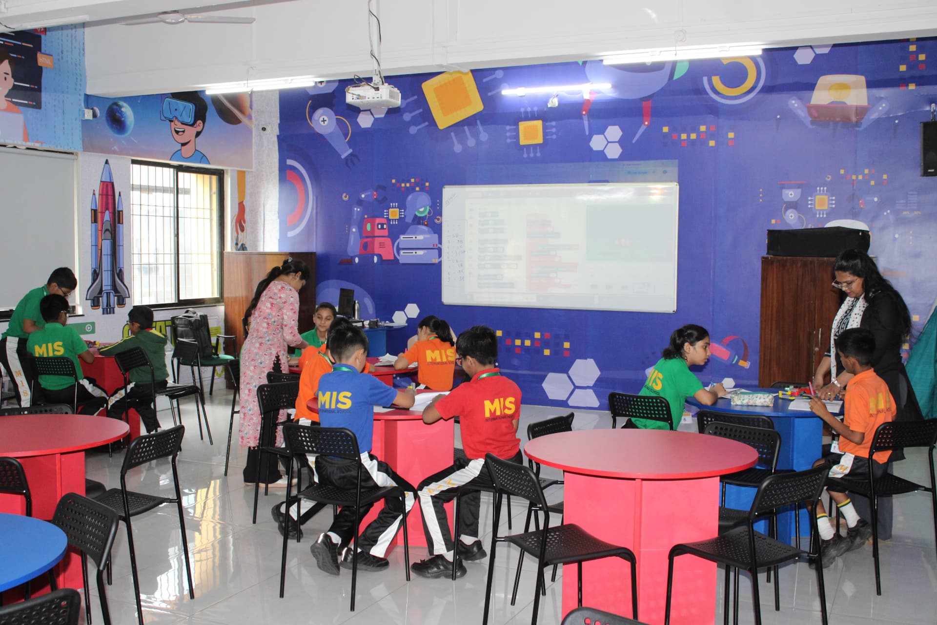 MIS International School students working in the coding and robotics classroom